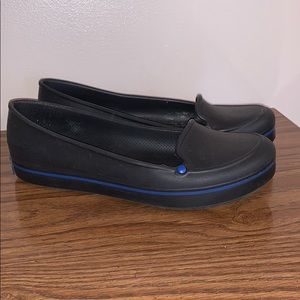 Black slip on crocs flats